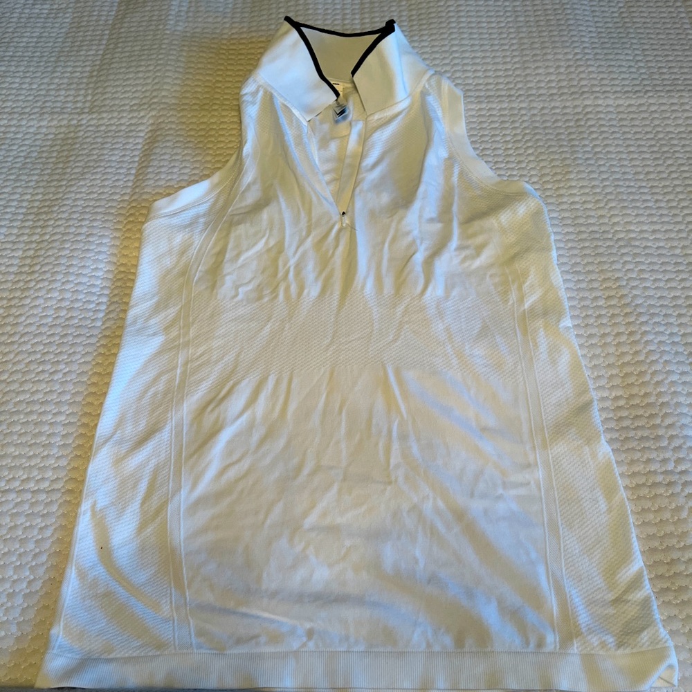 Athleta racer back golf shirt. White w black trim on collar. Size small.